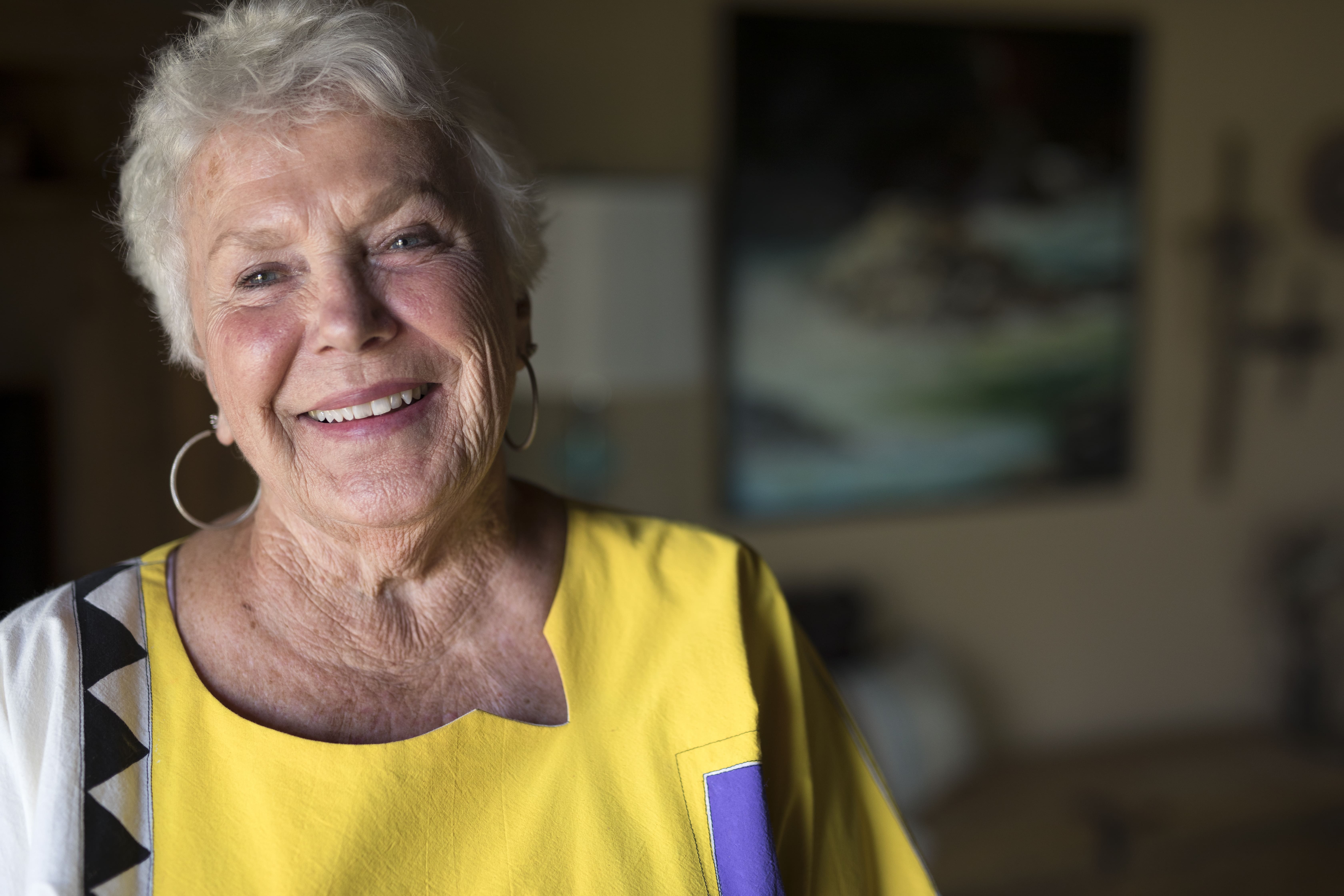 Woman in yellow shirt smiling